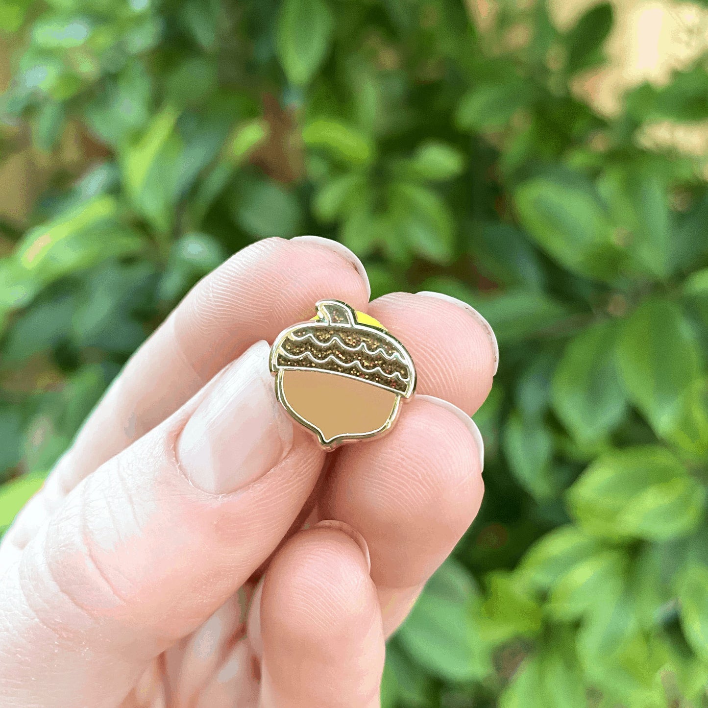 glittery acorn enamel pin