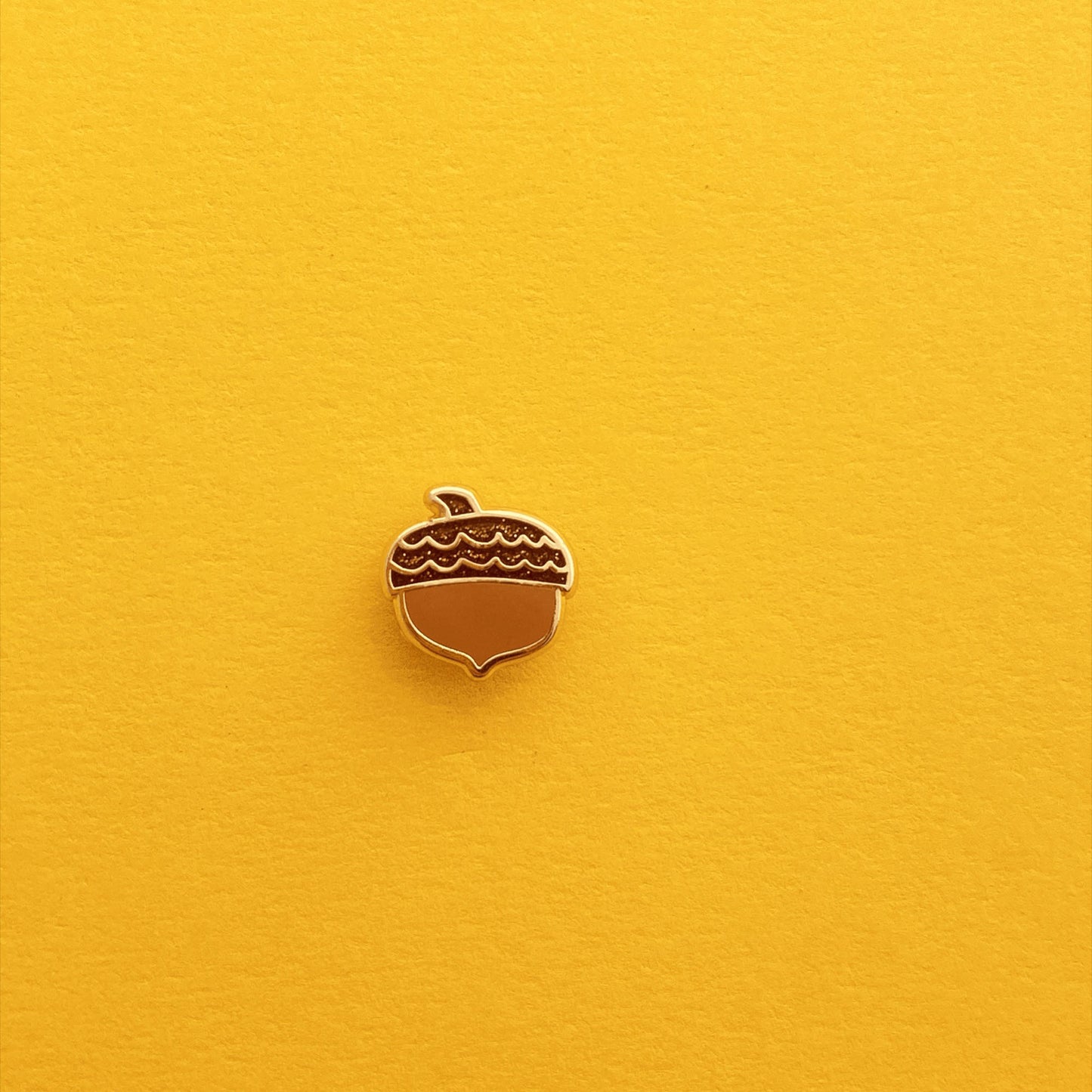 glittery acorn enamel pin